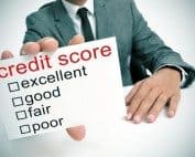 High-quality image of a man in a suit holding a credit score evaluation card.