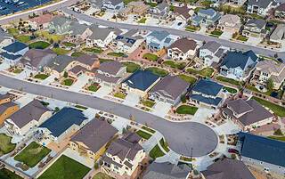 Real estate agent reviewing a purchase contract with home buyers in Grand Junction, Colorado
