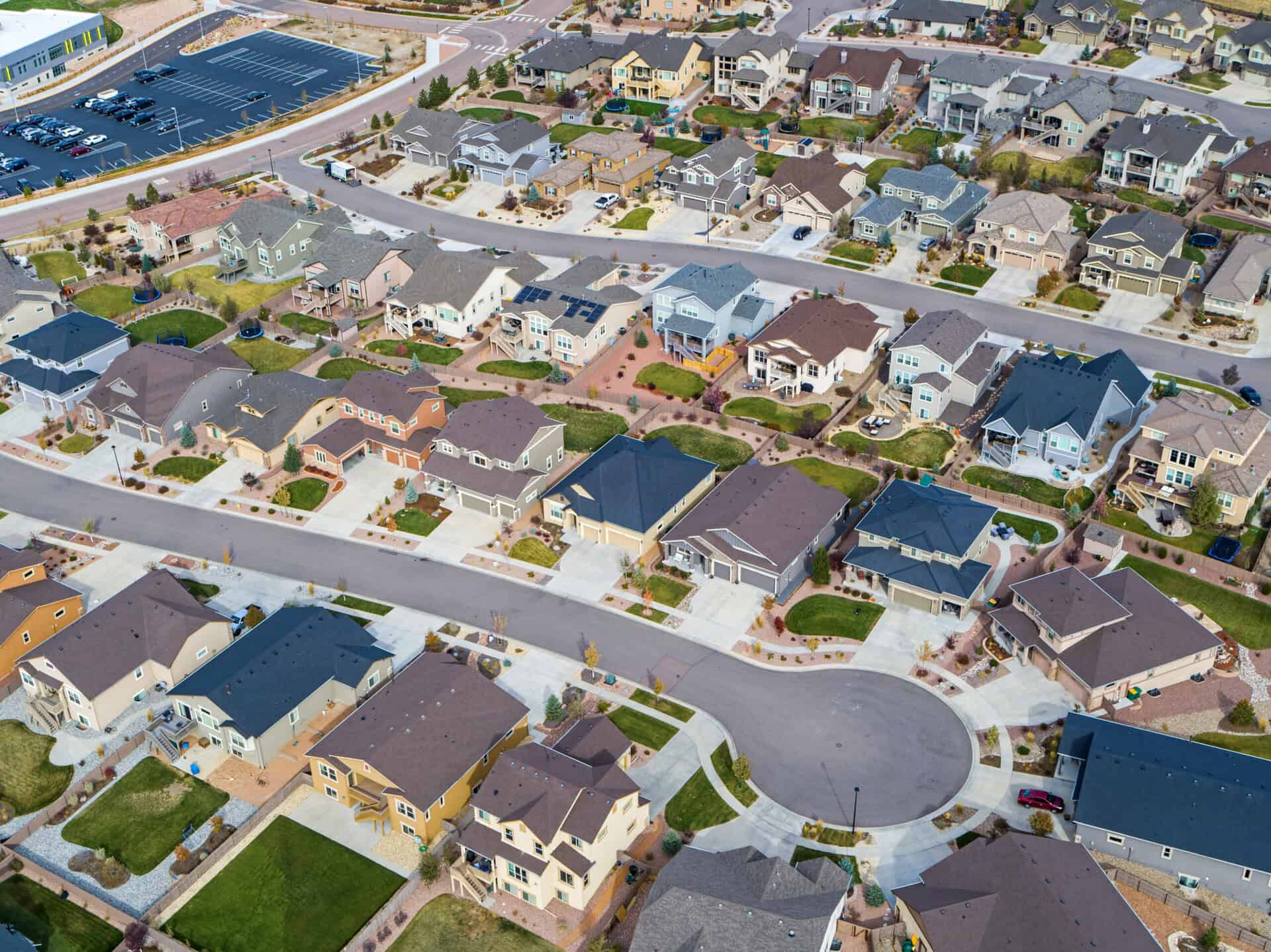 Real estate agent reviewing a purchase contract with home buyers in Grand Junction, Colorado